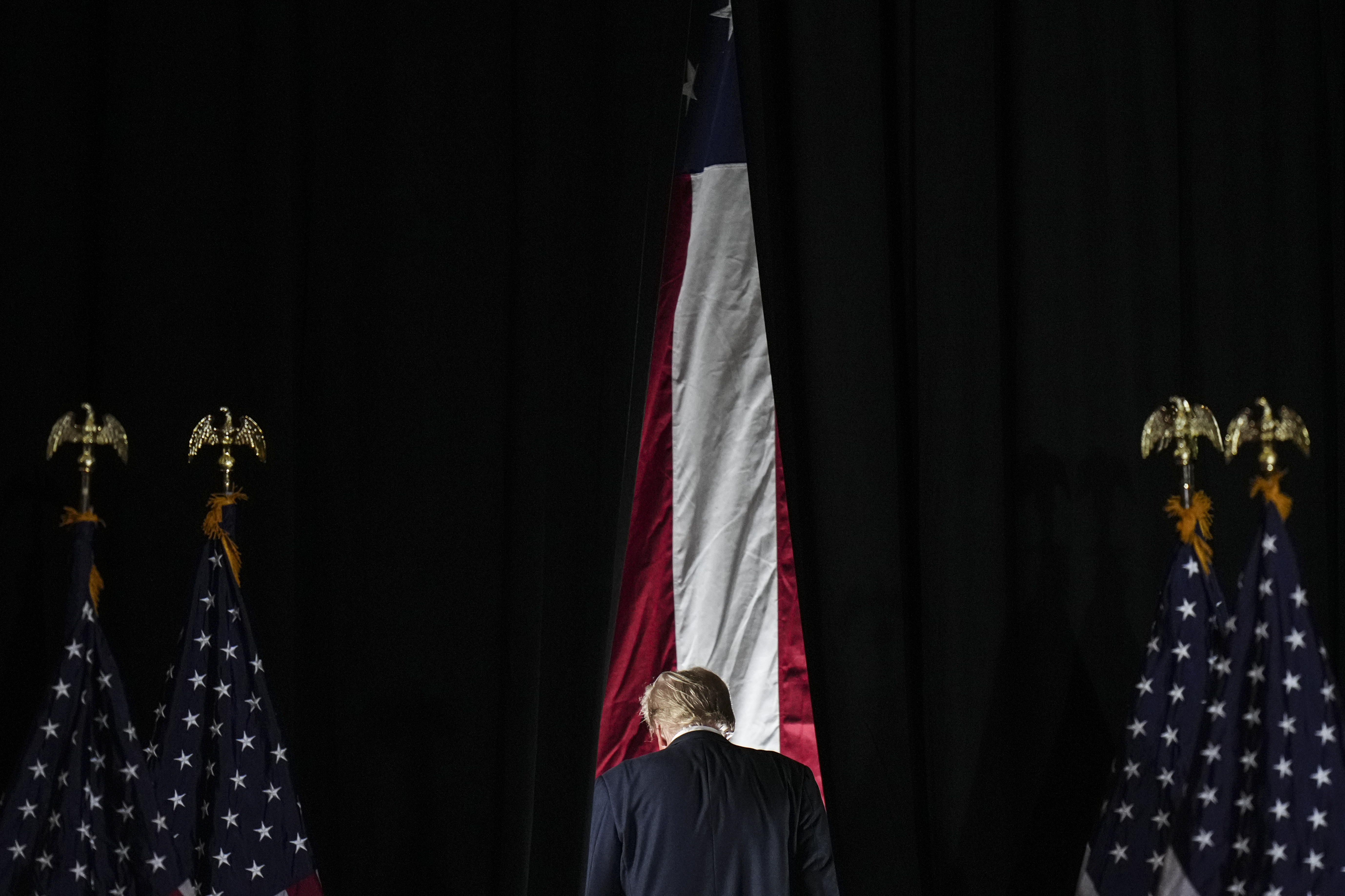 Republican presidential nominee former President Donald Trump leaves the stage after a campaign rally at Grand Sierra Resort and Casino in Reno, Nev., Friday, Oct. 11, 2024. (AP Photo/Jae C. Hong)