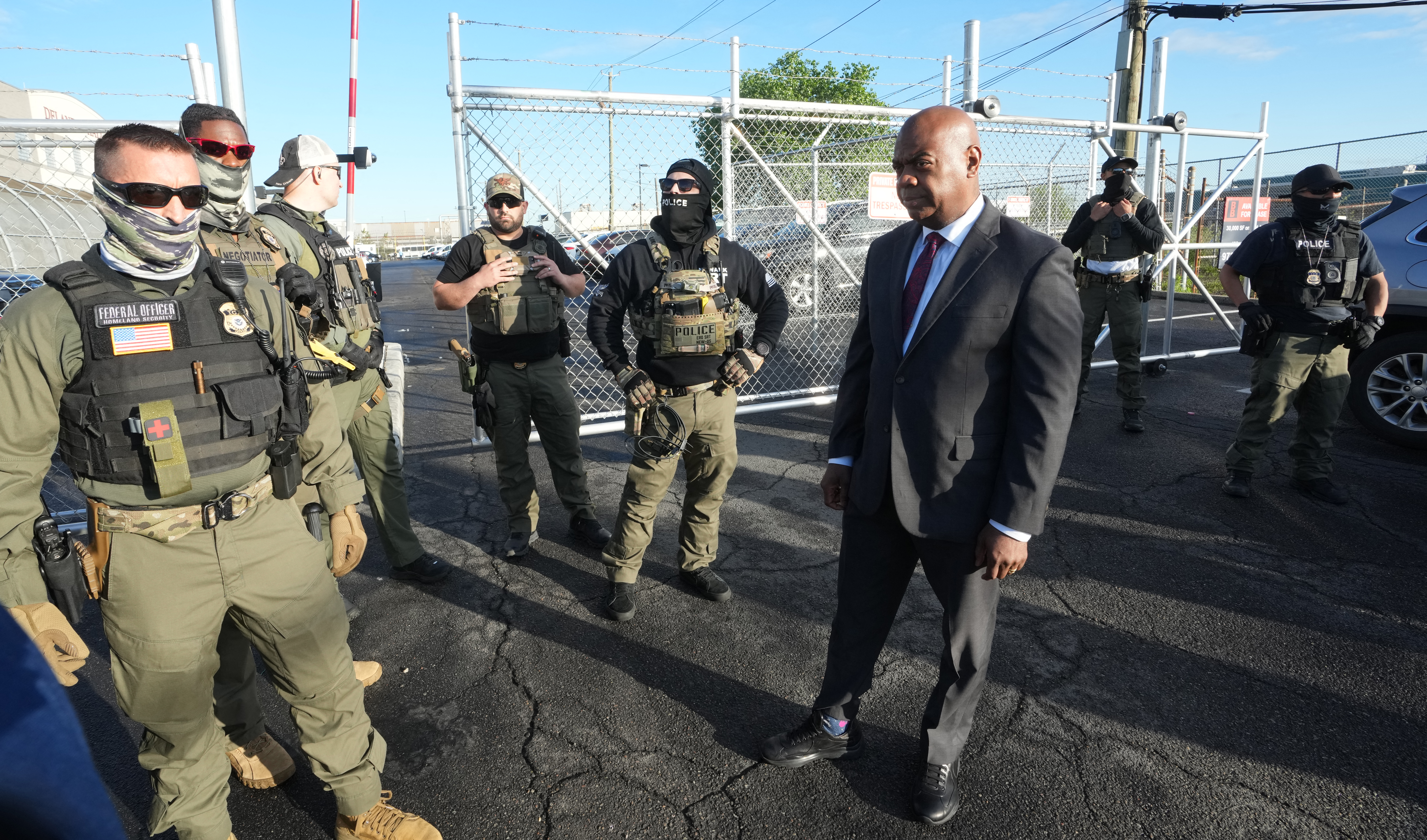 Mayor Ras Baraka of Newark confronts ICE agents at a demonstration outside an immigrant detention centre in Elizabeth, New Jersey May 7, 2025. The Mayor arrived at the gates of Delaney Hall to inspect the previously vacant prison that is being converted into an immigrant detention center. Delaney Hall has the ability to hold over a 1000 people, and the detention facility, privately owned by The GEO Group, holds a contract with the federal government to house people arrested by ICE. (Photo by TIMOTHY A. CLARY / AFP) (Photo by TIMOTHY A. CLARY/AFP via Getty Images)