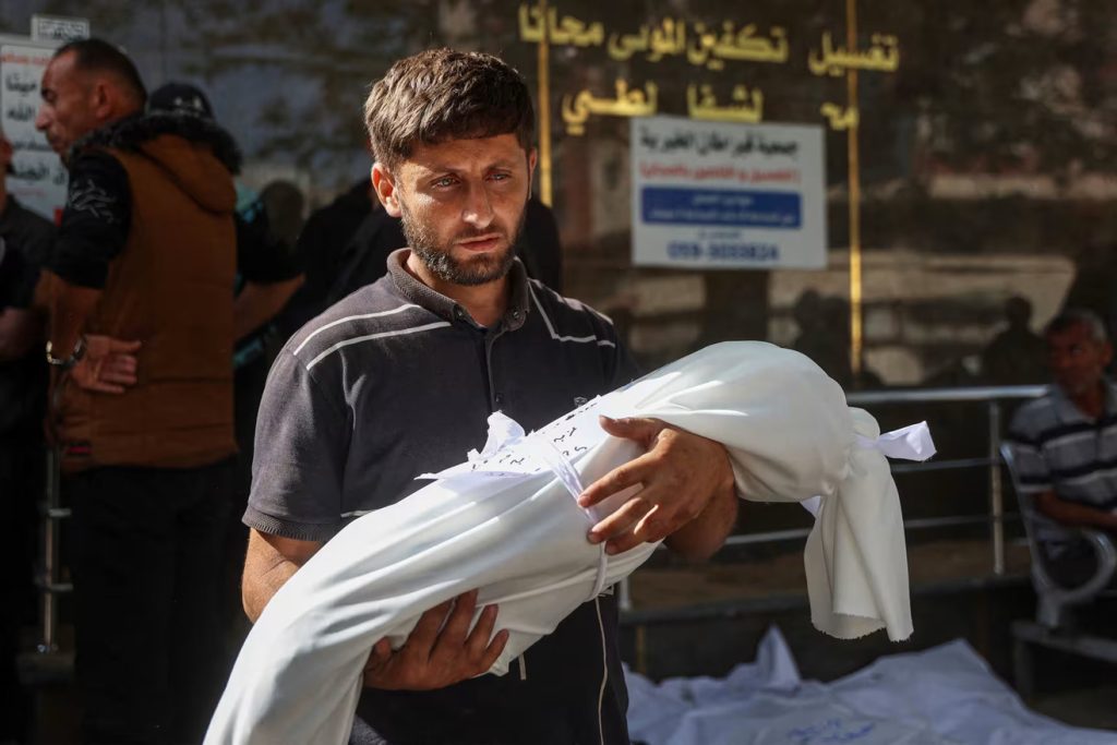 Israeli strikes kill 52 in Gaza, including 36 sheltering in school, medics report