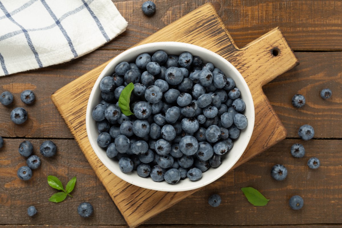 Bowl Of Blueberries On Wooden Table